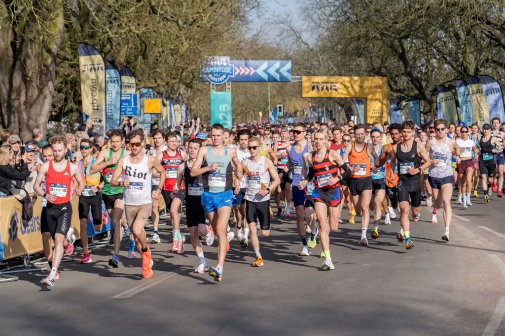 Runners coming along a tree-lined road